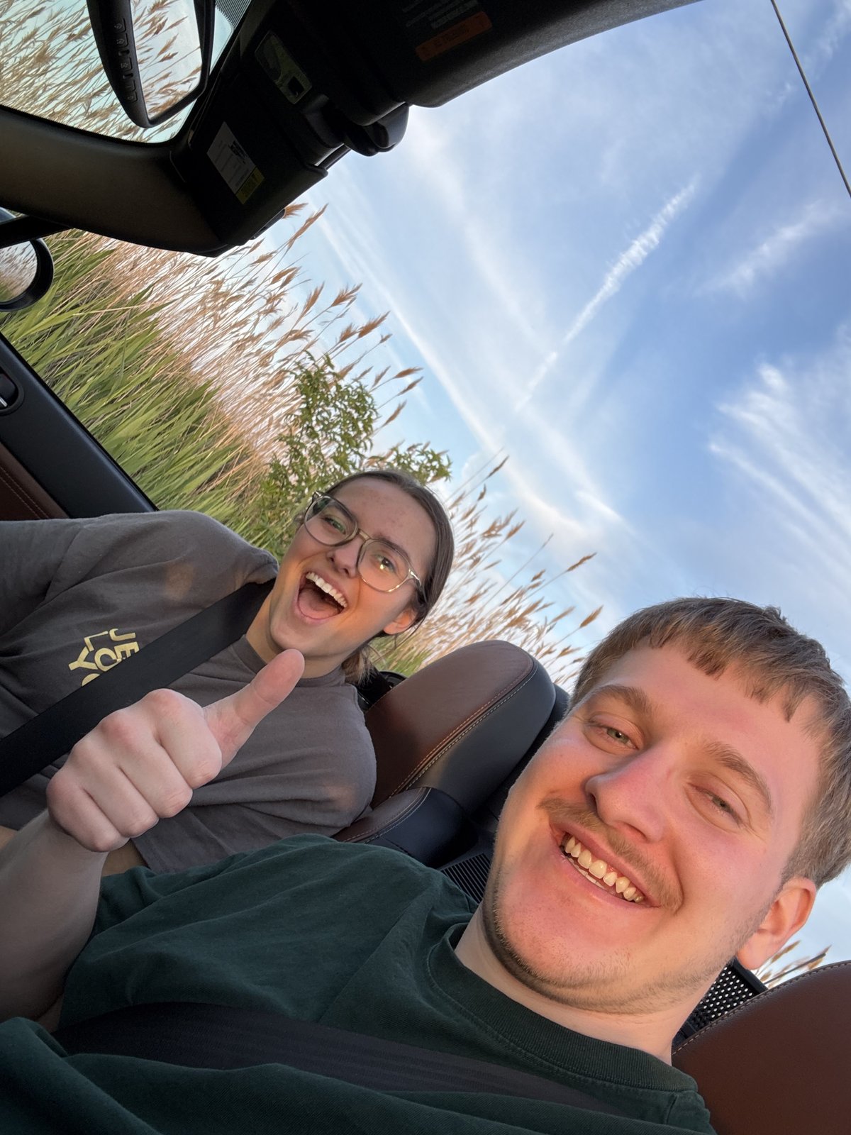 Joseph and Maria in the Miata with the top down