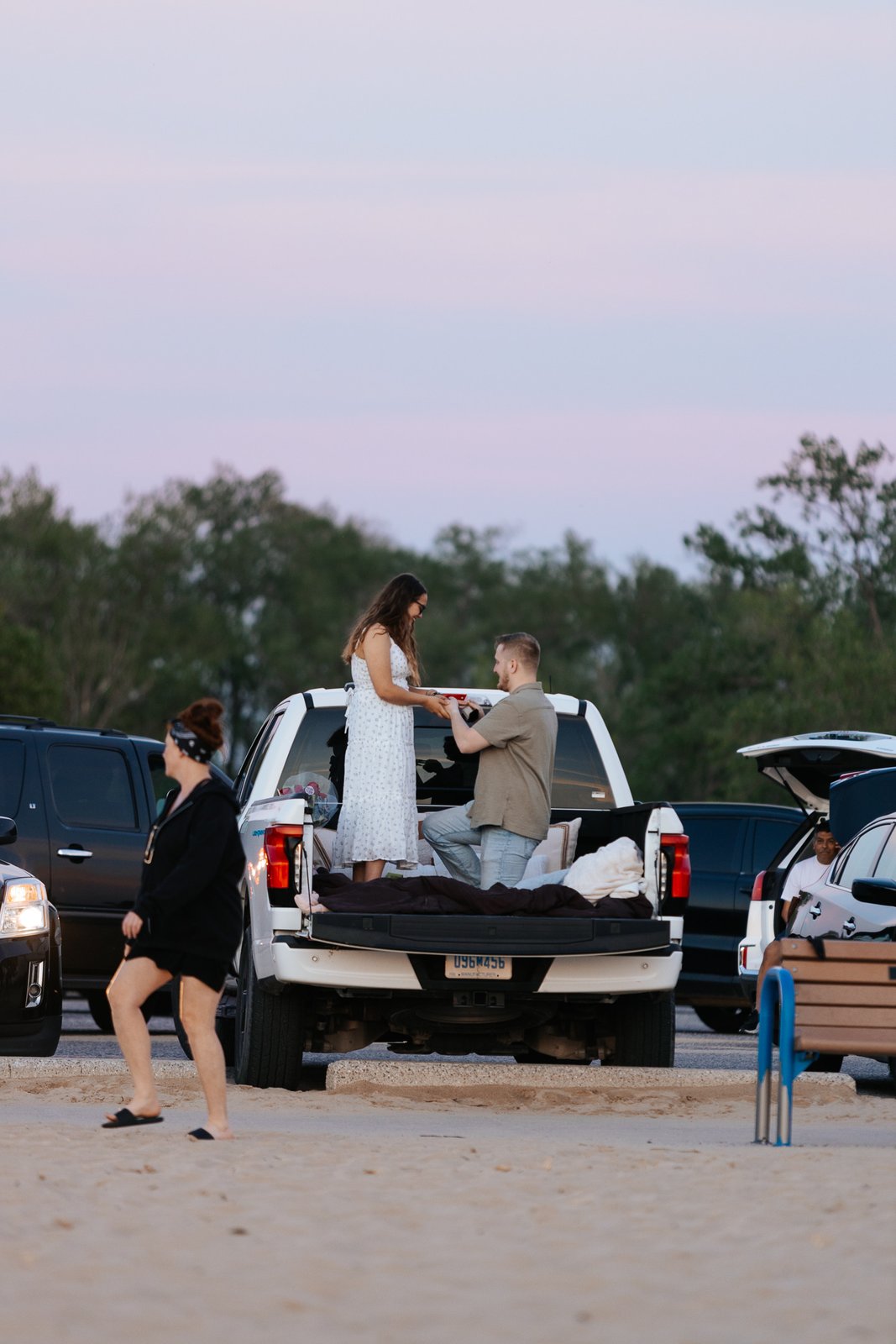 Joseph proposing to Maria in the bed of an F-150 Lightning at the beach